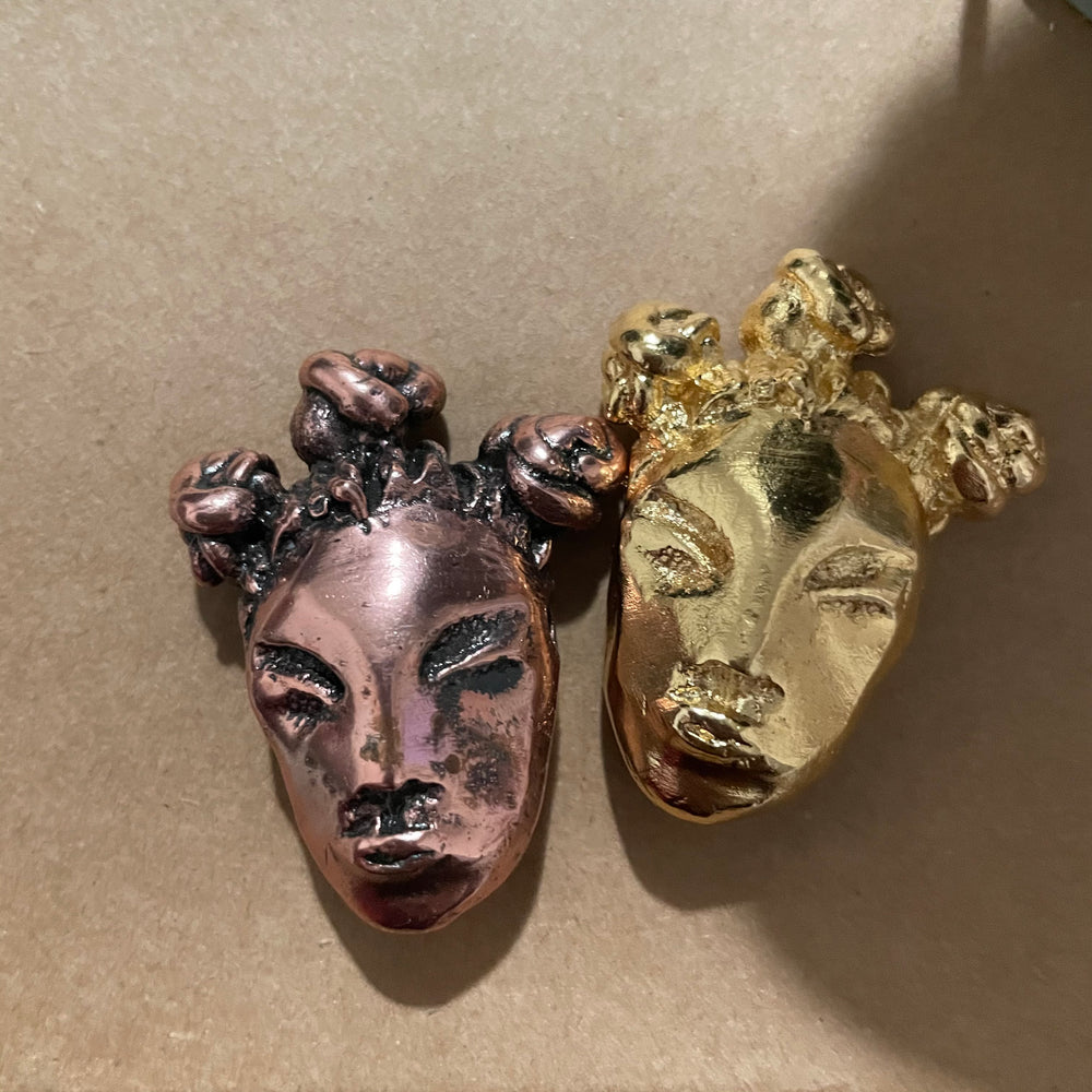 bantu baby talisman in both copper plating and gold plating